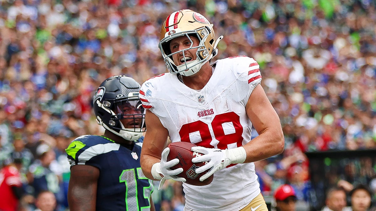 Jake Tonges smiles after touchdown
