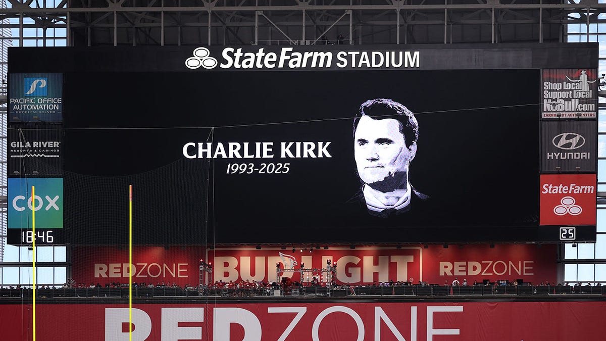 The video board shows a tribute to Charlie Kirk prior to a game between the Carolina Panthers and the Arizona Cardinals at State Farm Stadium on Sept. 14, 2025 in Glendale, Arizona.