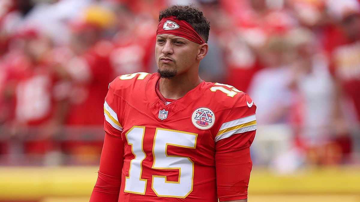 Patrick Mahomes looks on field