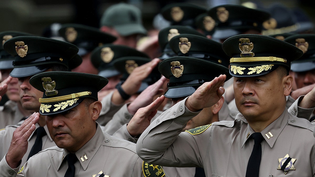 Members of the Los Angeles Sheriff's Department salute during the National Peace Officers Memorial Service at the U.S. Capitol on May 15, 2024, in Washington, DC. The Service honors law enforcement officers who have been killed in the line of service.