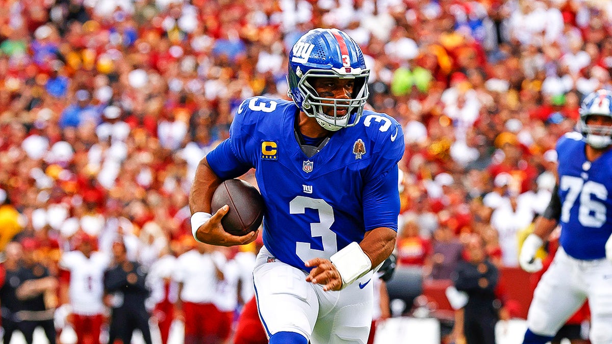 Russell Wilson runs with ball