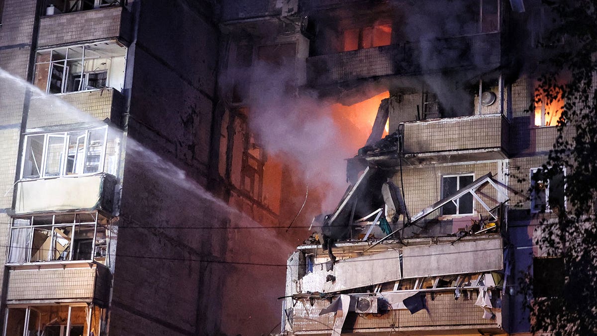 Ukrainian building hit during Russian drone and missile strike