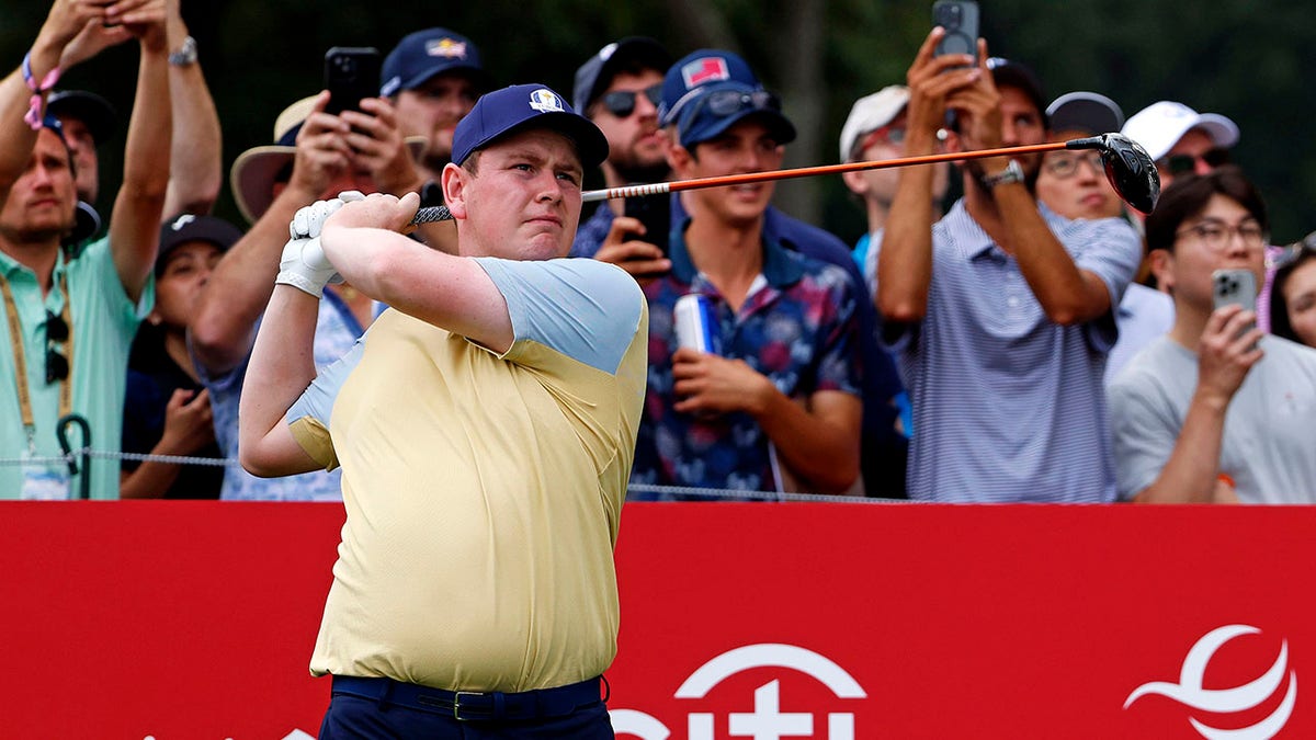 Robert MacIntyre looks on