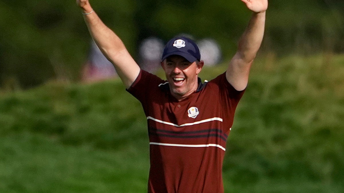 Rory McIlroy looks on