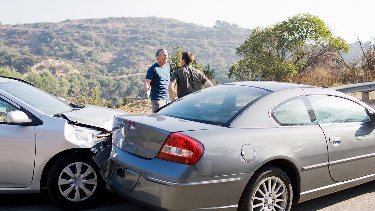Two men arguing after car accident