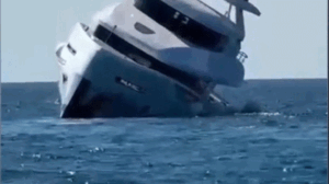 Luxury yacht tips and sinks minutes after launch as terrified passengers jump overboard