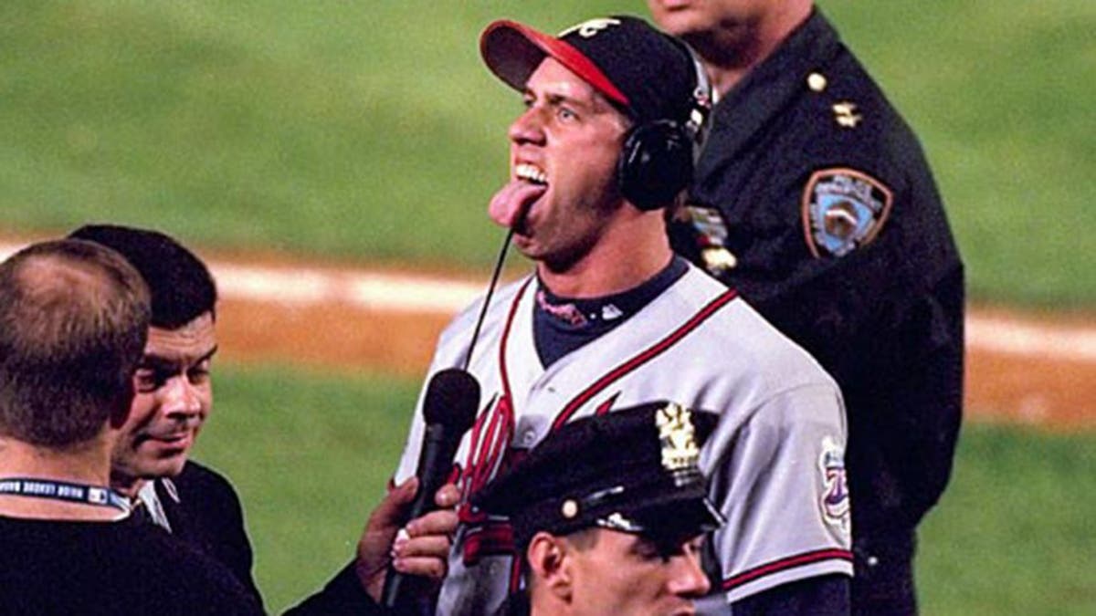 Baseball: NLCS Playoffs. Atlanta Braves John Rocker (49) taunting and gesturing fans during media interview after Game 5 vs New York Mets. Flushing, NY 10/17/1999 MANDATORY CREDIT: Al Tielemans/Sports Illustrated SetNumber: X58920
