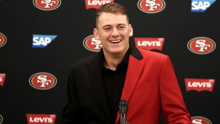 49ers’ Mac Jones explains motivation behind wearing suits on game day: ‘I’m going to work’