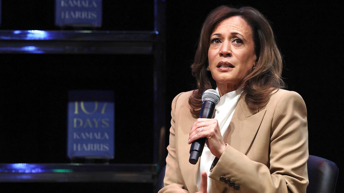 Kamala Harris speaks on stage during book tour