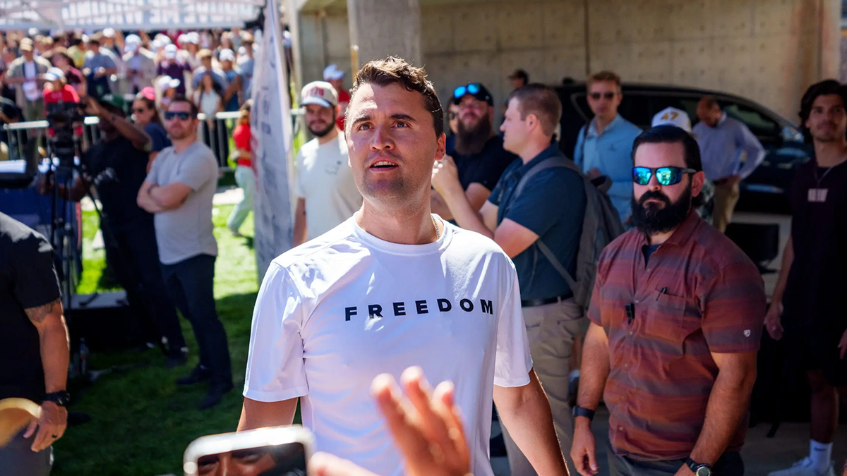 Charlie Kirk in a white T-shirt emblazoned with the word "Freedom" at UVU shortly before his assassination