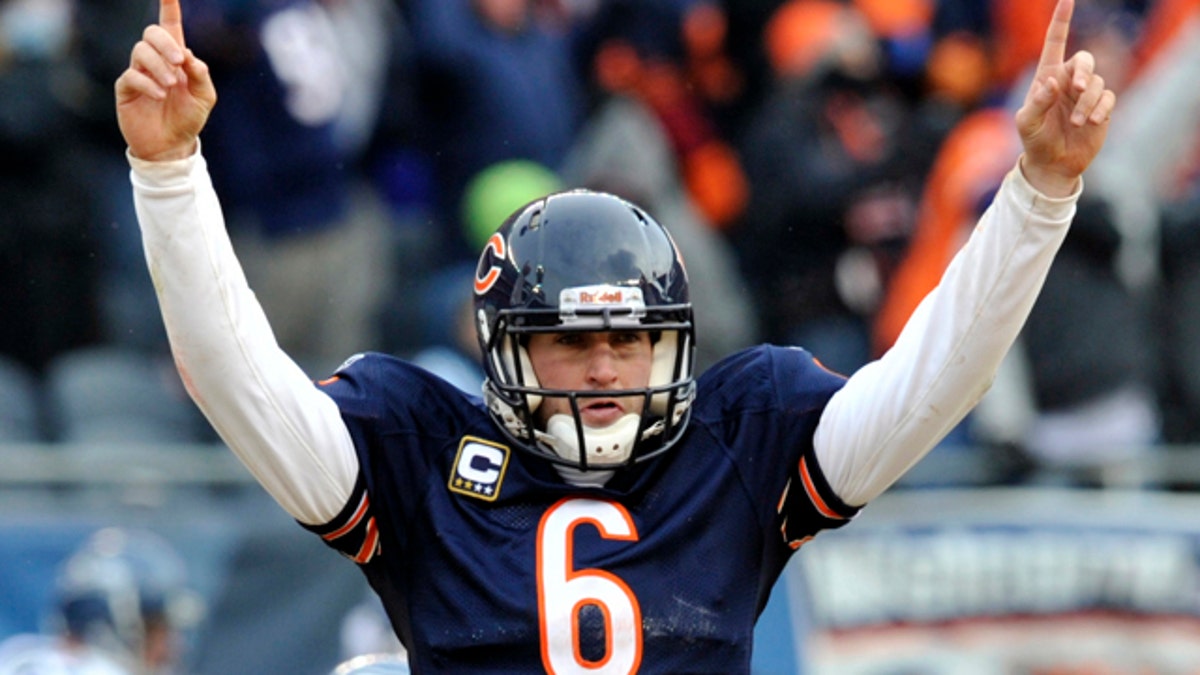 Chicago Bears quarterback Jay Cutler (6) reacts to a touchdown against the Seattle Seahawks during the second half an NFL divisional playoff football game Sunday, Jan. 16, 2011, in Chicago. (AP Photo/Jim Prisching)