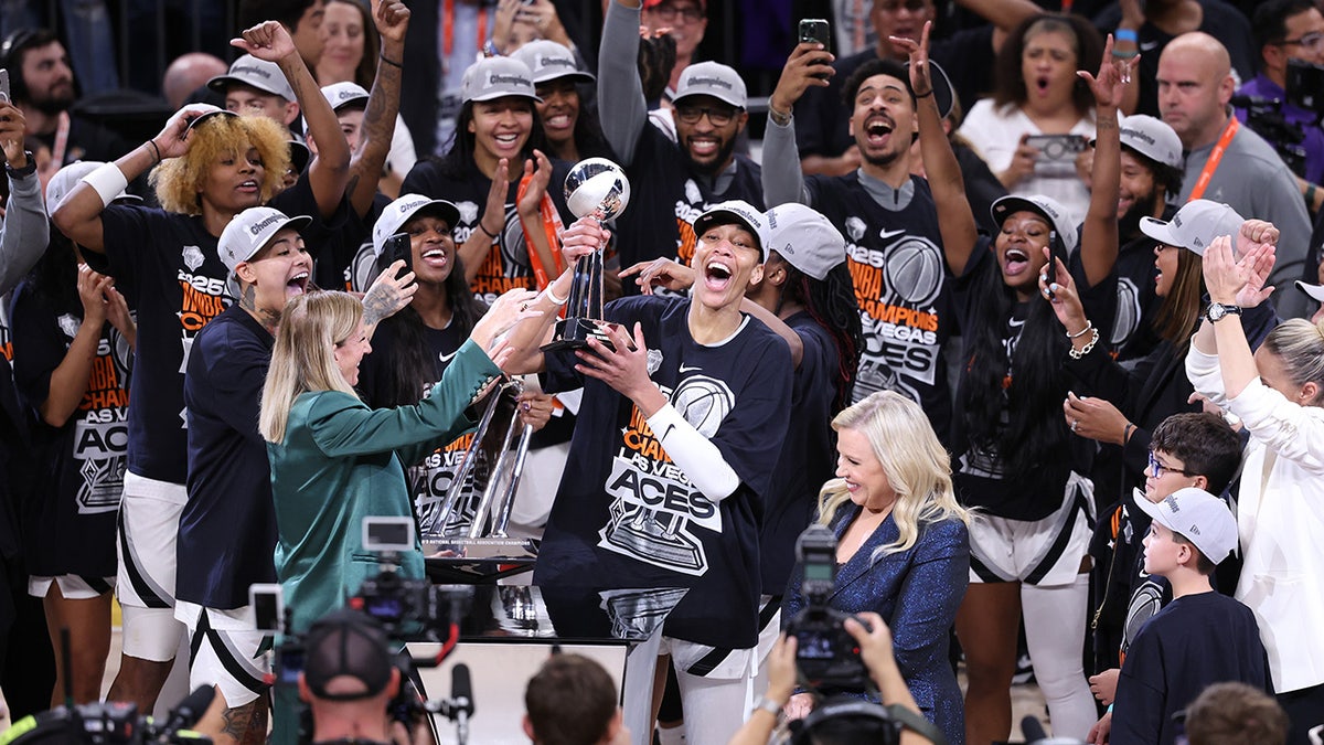 Vegas Aces with trophy