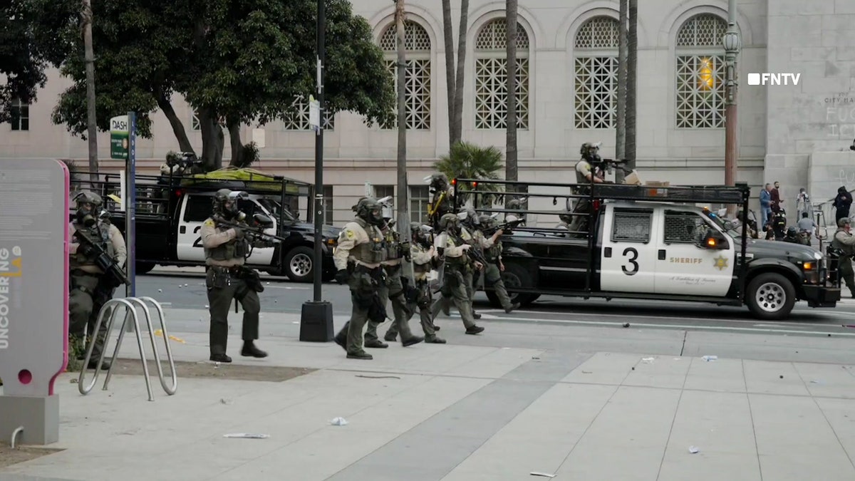 Police react during anti-ICE protests in Los Angeles in June. LA County announced a state of emergency Tuesday over a recent surge in ICE raids in the city.