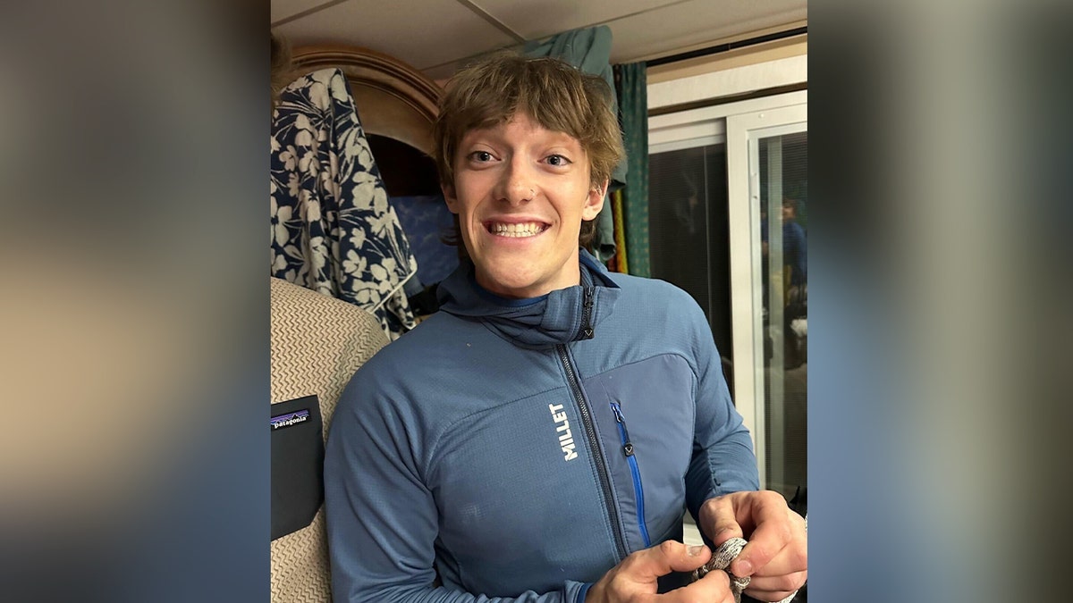 man smiling with blue jacket on
