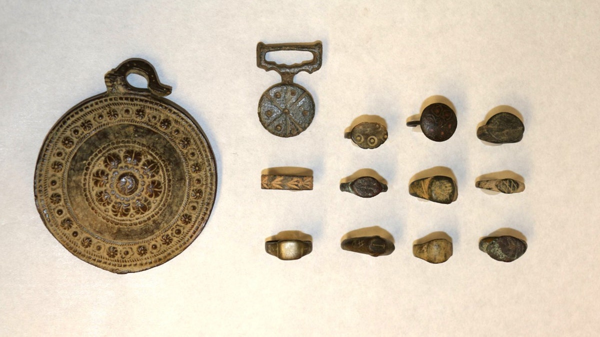Layout of medallions, rings, showing signs of wear and patina