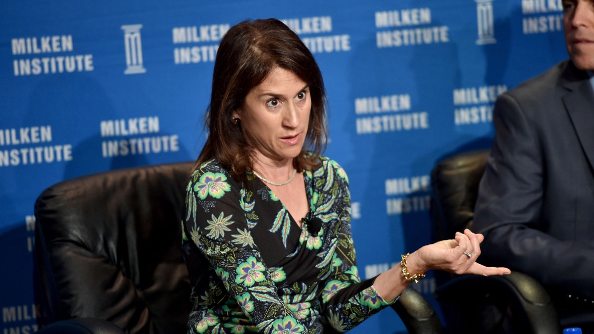 Elizabeth Simons speaks at a conference.