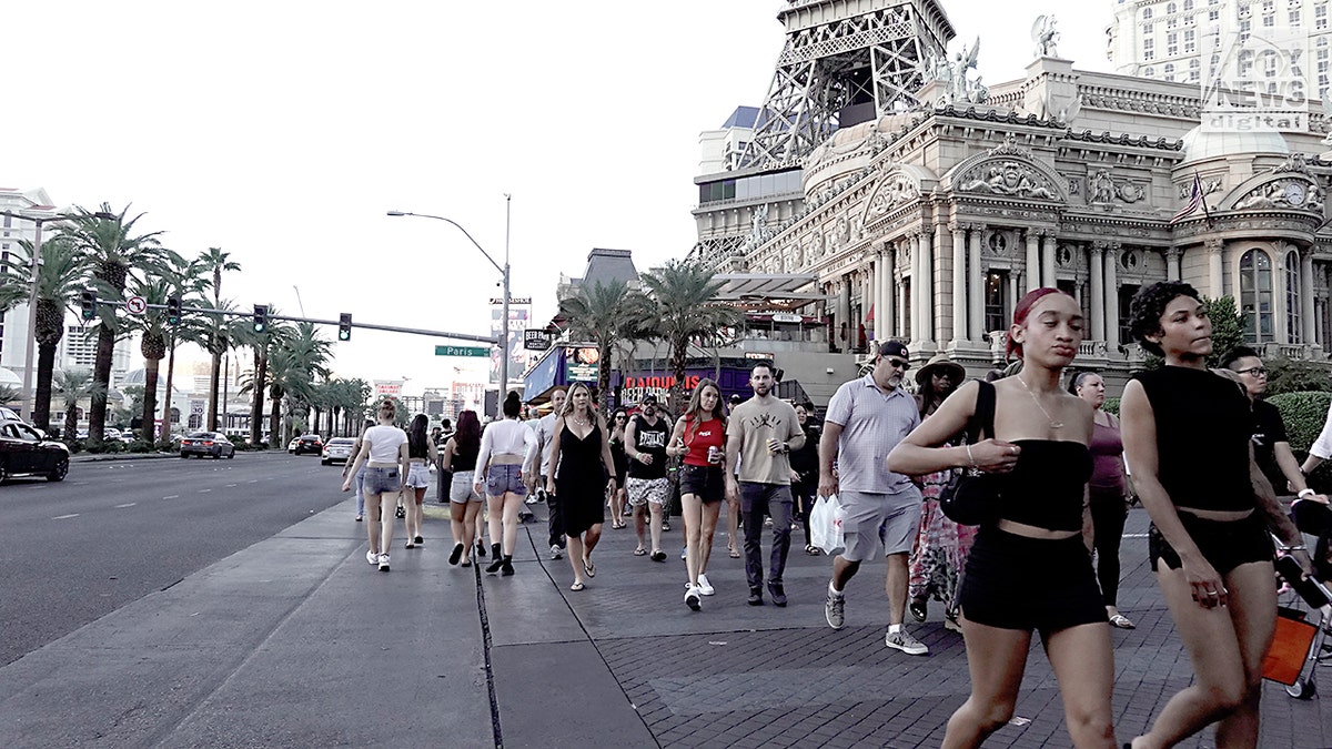 Travelers walking through the streets of Las Vegas.