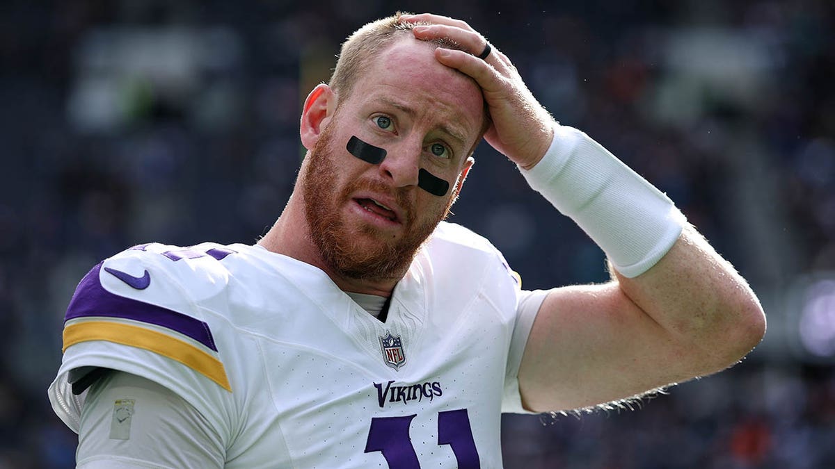 Carson Wentz rubs his head