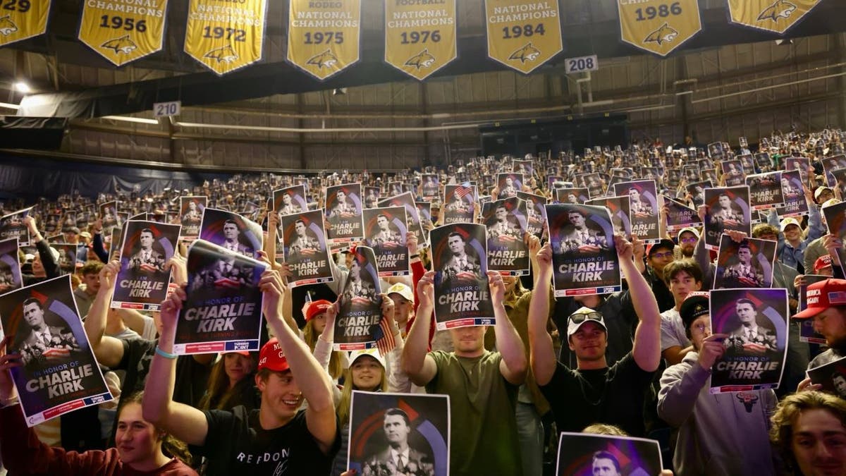 Students at Montana State University hold signs supporting Charlie Kirk during a campus event.