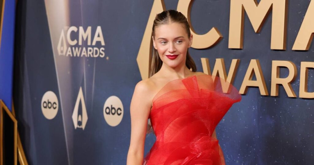 Kelsea Ballerini Walks 2025 CMA Awards Red Carpet Solo in Fiery Dress After Chase Stokes Reunion