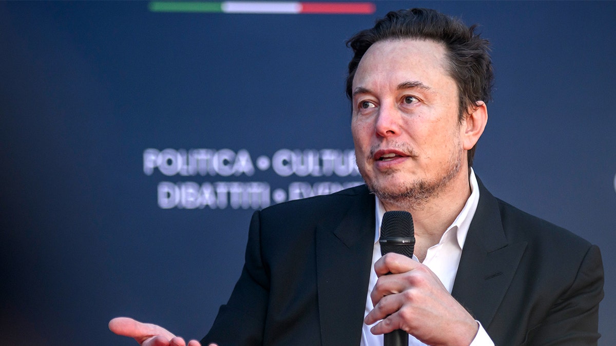 Musk speaking at event in Italy.