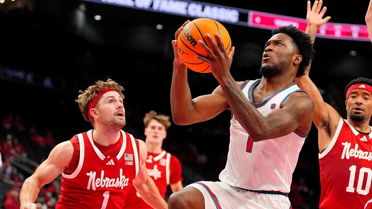 Deyton Albury shoots over a Nebraska guard