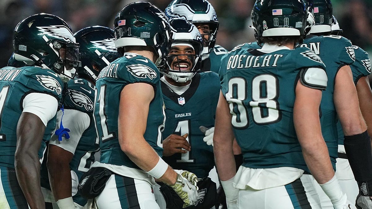 Jalen Hurts in the huddle