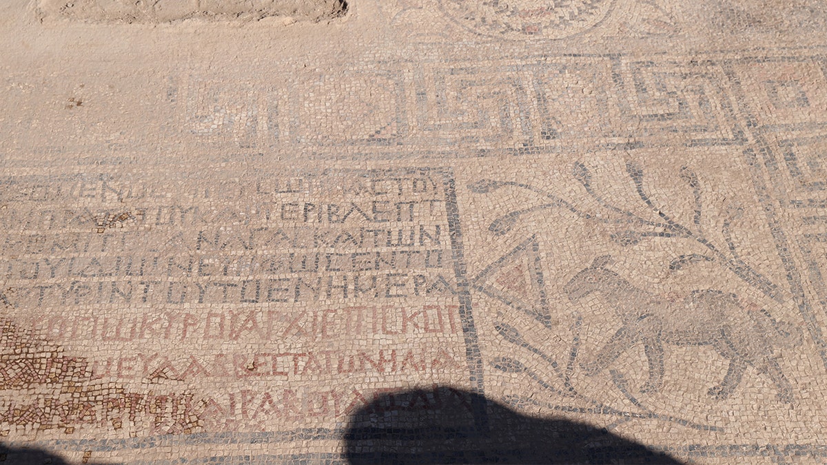 Greek text, motif of animal at site