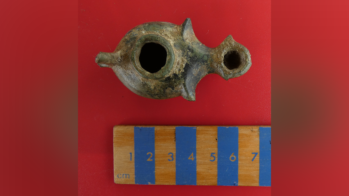Votive lamp found during dig