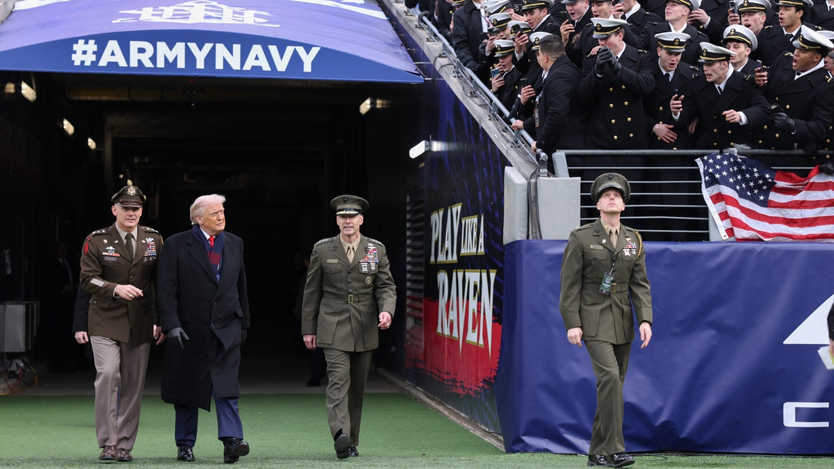 President Trump walks onto the field at the Army vs. Navy game