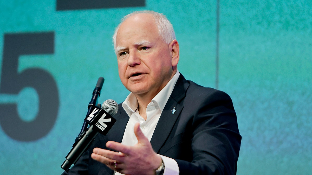 Tim Walz speaks onstage