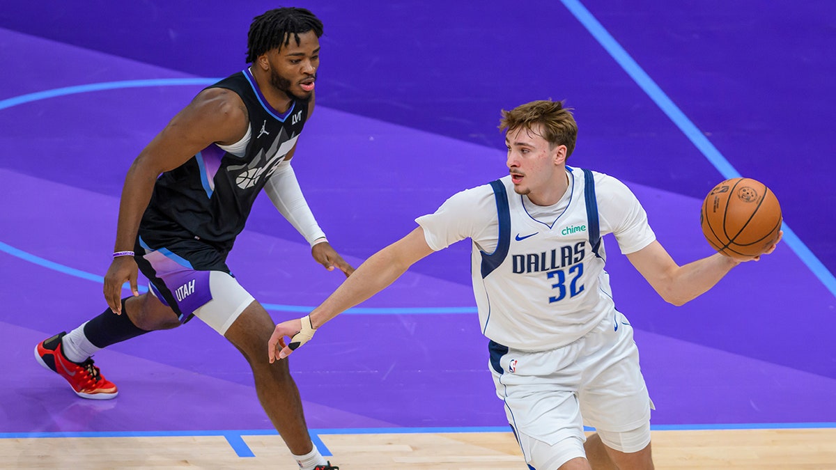 Cooper Flagg dribbles the ball