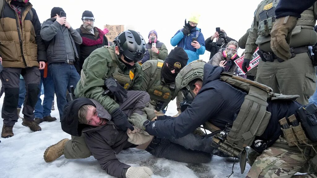 Minneapolis protesters confront federal agents day after deadly shooting