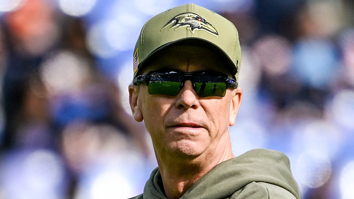 Todd Monken looks on