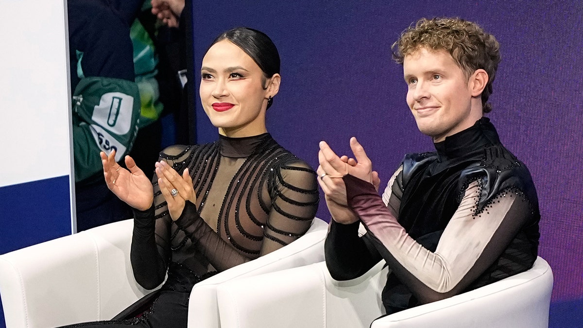 Madison Chock and Evan Bates clap