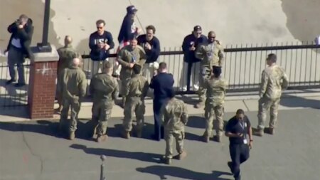 US men’s hockey stars share gold medal moment with military members before White House visit