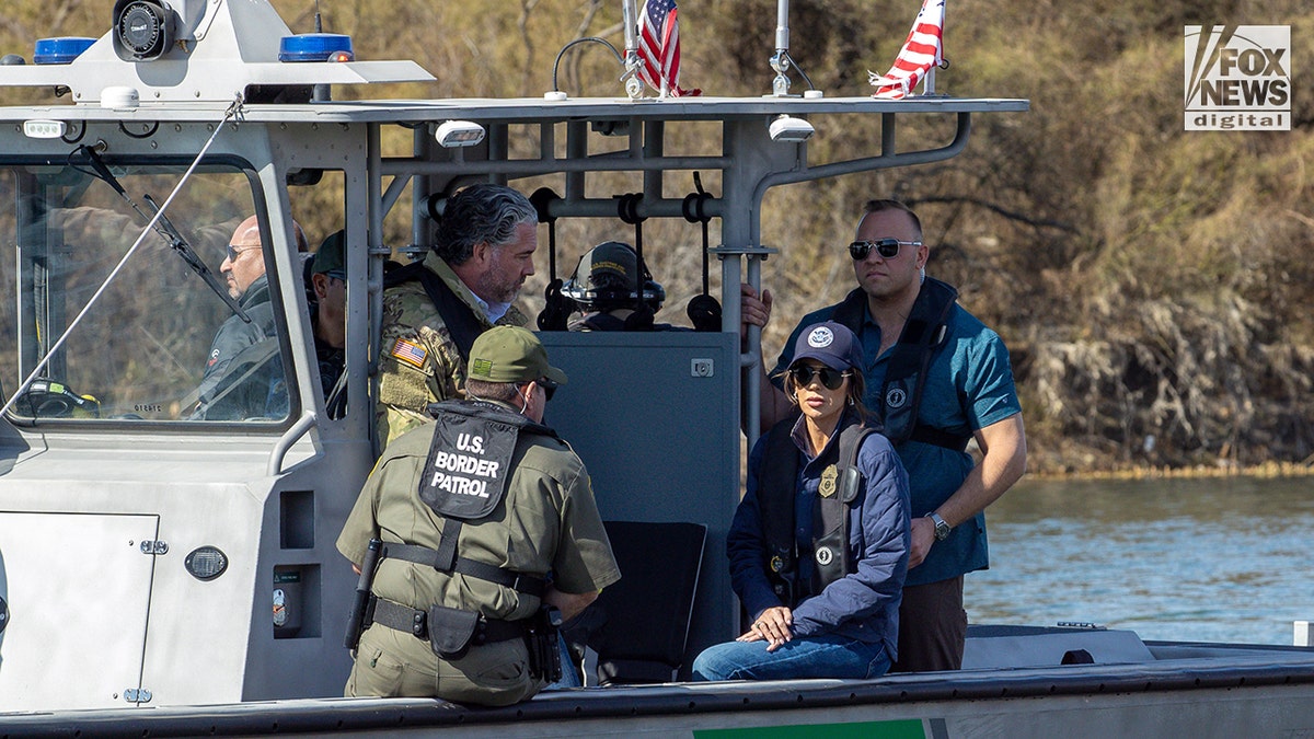 Kristi Noem standing with CBP officials outdoors in Eagle Pass, Texas