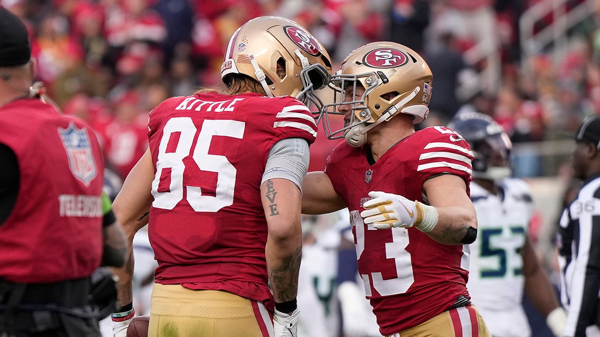Christian McCaffrey and George Kittle