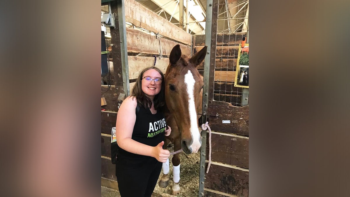 hallie tobler with a horse