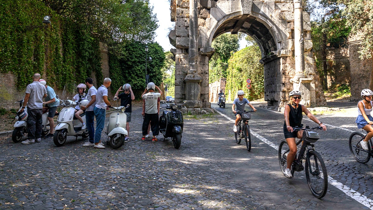Tourists biking Appian Way
