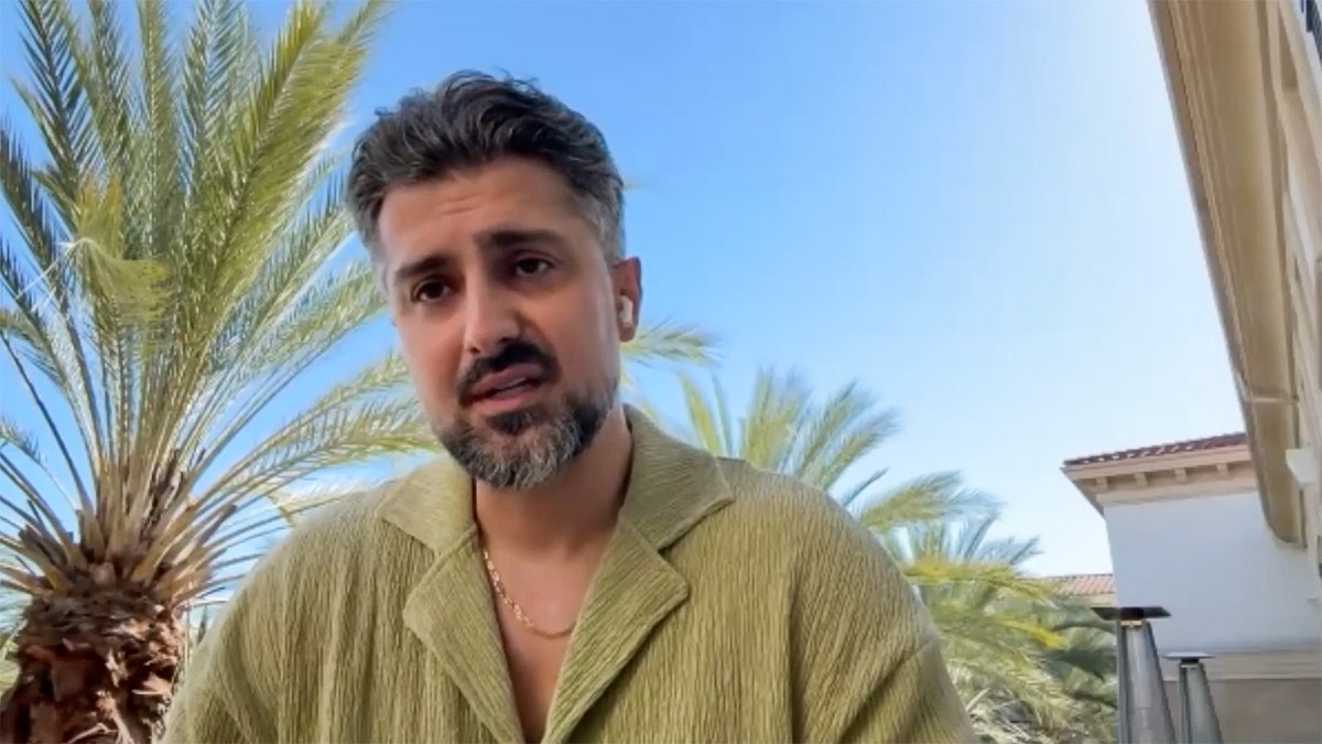 Store owner giving an interview.