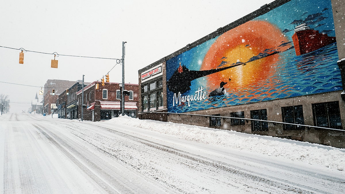 Snow blankets streets and buildings in Marquette.