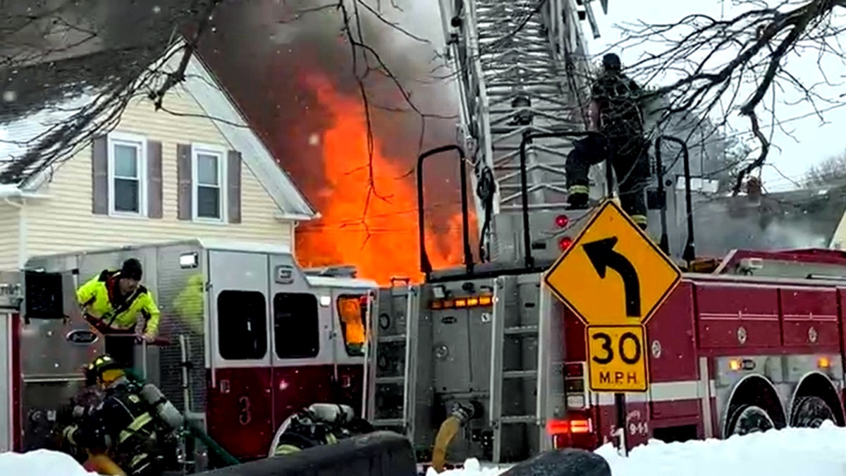 Firefighters respond to a home engulfed in flames