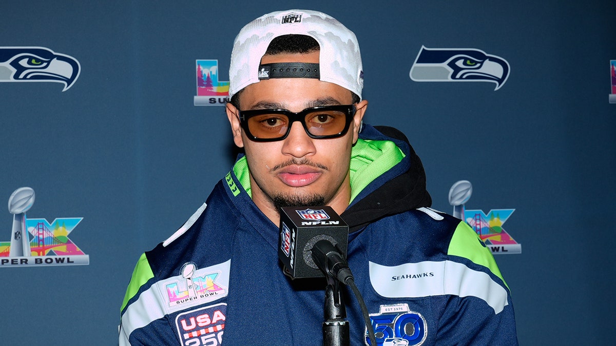 Jaxson Smith-Njigba talks to reporters