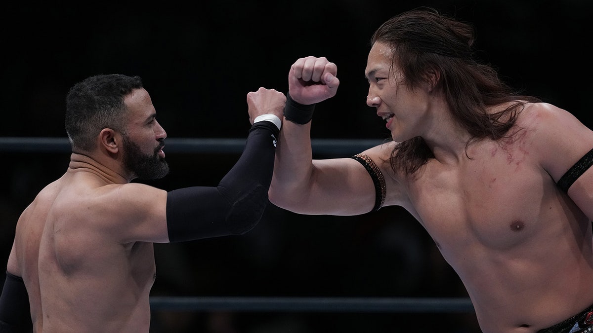 Konosuke Takeshita and Rocky Romero in the ring