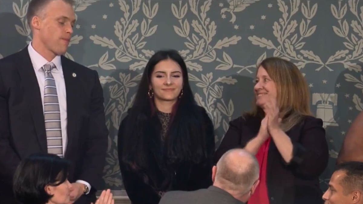 Sage Blair and her mother standing in the gallery during Trump’s State of the Union address