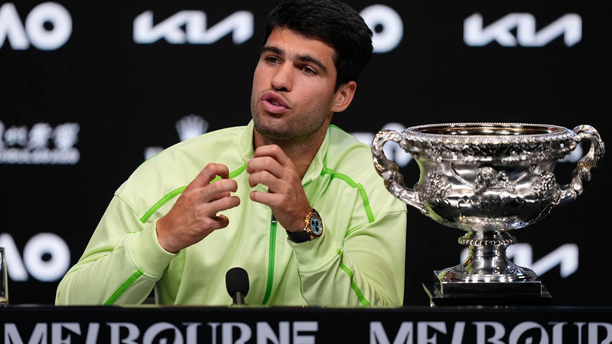 Carlos Alcaraz speaks to the media