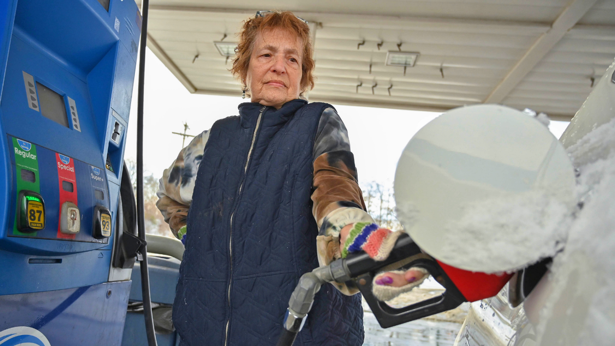 A woman is seen pumping gas at a station in upstate New York.