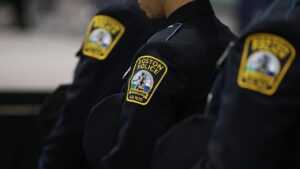 Boston officer charged with manslaughter after shooting carjacking suspect as video disputes account