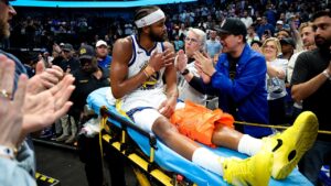 Warriors’ Moses Moody leaves game on stretcher after suffering gruesome injury on dunk attempt